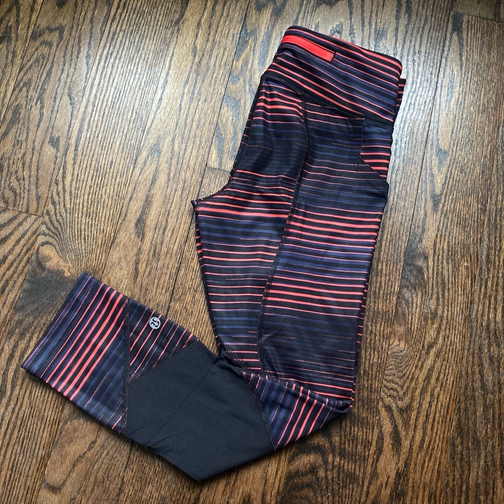 . Women's Lululemon Leggings Size 2 orange/Red Black